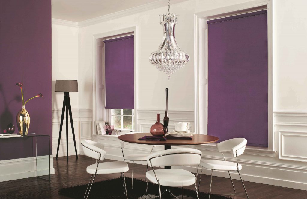 white and purple room with purple roller blinds on the windows