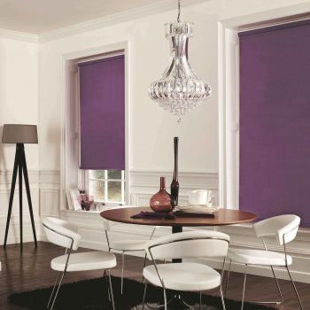 white and purple room with purple roller blinds on the windows